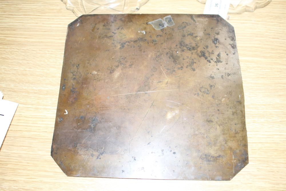 A 19th century engraved copper printing plate, probably later gilded, depicting figures around a stag